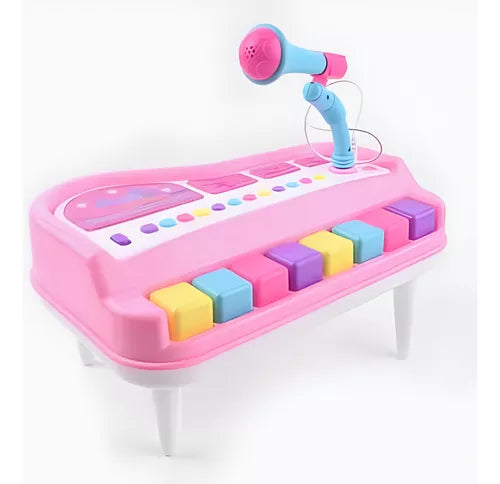 Piano de juguete con micrófono